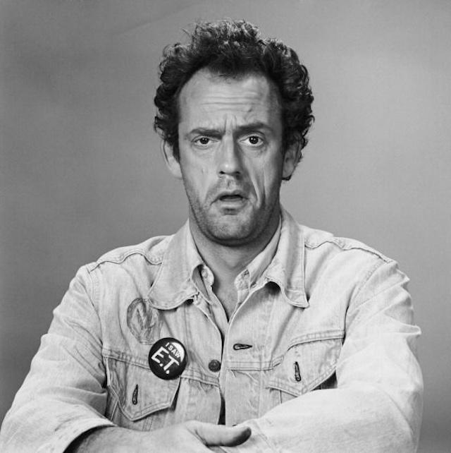 A portrait of Christopher Lloyd as the quirky Reverend Jim, showcasing his iconic denim jacket. 