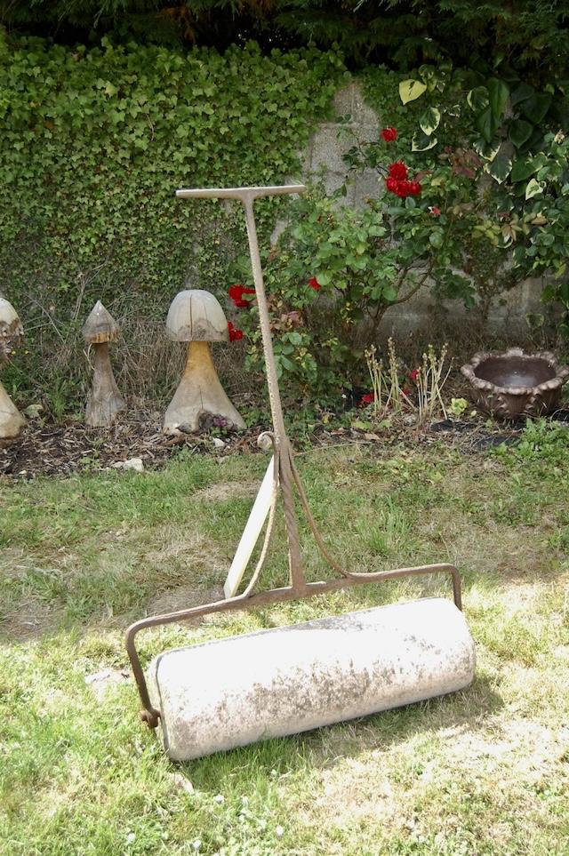 Another vintage tool used to flatten and smooth lawns after mowing or seeding, ensuring an even surface.