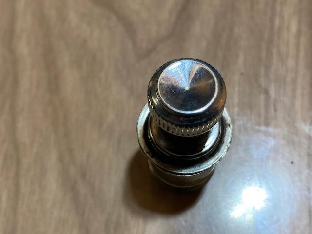 A classic vintage car cigarette lighter, once a staple in every vehicle