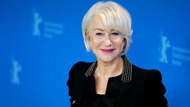 Helen Mirren, an iconic actress known for her elegance, embracing her natural gray hair while making a powerful statement about beauty at any age
