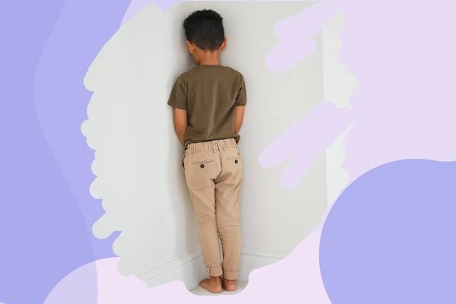 A modern take on the time-out method, with a child standing in the corner as part of a gentler approach to discipline, highlighting how this technique is still used today but in more emotionally supportive contexts