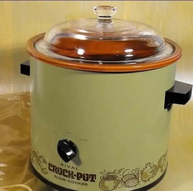 A classic Rival Crock-Pot slow cooker, this vintage design was a staple in kitchens for decades, known for its durability and reliability