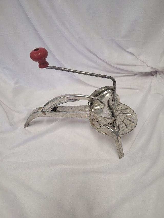 With its distinct red handle and metal frame, this Mouli Grater made tasks like shredding cheese and slicing vegetables a breeze, capturing the spirit of mid-century kitchens