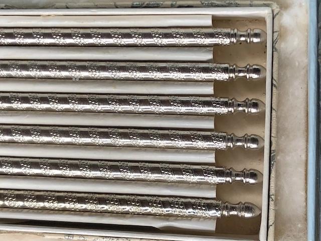 A set of beautifully crafted vintage nutcracker silver stainless tools, with unique textures and a polished finish, creating a nostalgic feel