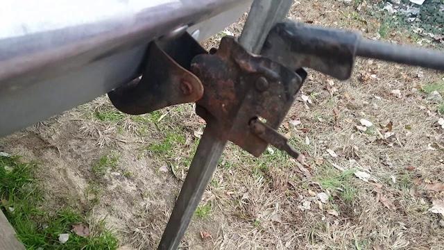 Close-up of the vintage bumper jack mechanism—simple but effective for its time