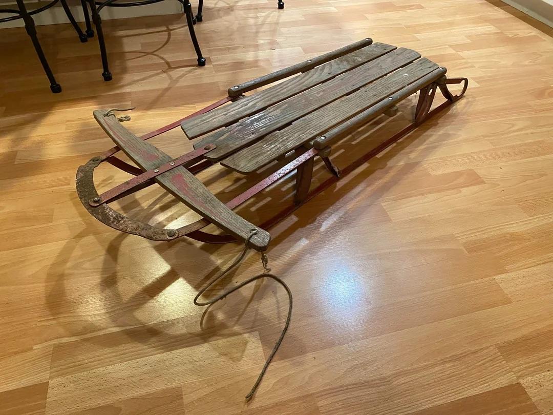 Wooden sleds like these were once a must-have for any snowy outing, built to withstand both time and terrain