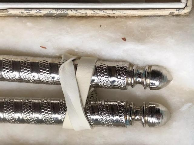 A close-up view of the vintage nutcracker silver stainless, designed with intricate detailing, used to crack nuts with elegance and precision