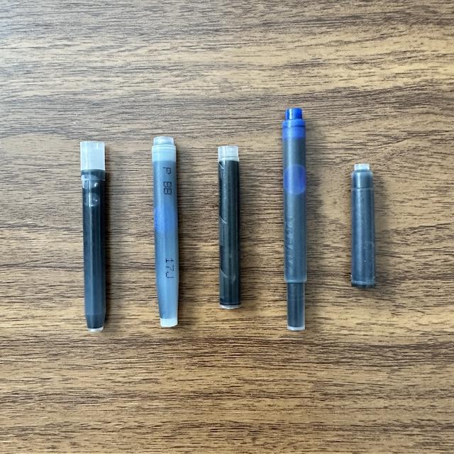 Different shapes and sizes of fountain pen ink cartridges, showcasing their evolution over time