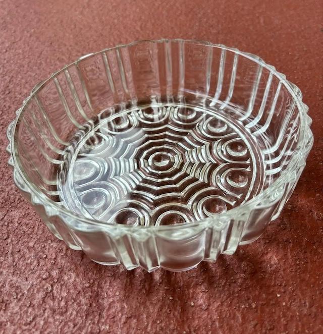 Without the lid, the beauty of the dish itself shines through, revealing detailed craftsmanship – a testament to its era