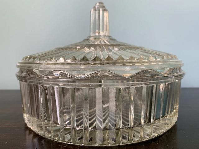 A closer look at the ribbed glasswork and delicate details of this vintage candy dish, bringing a touch of history into any modern home