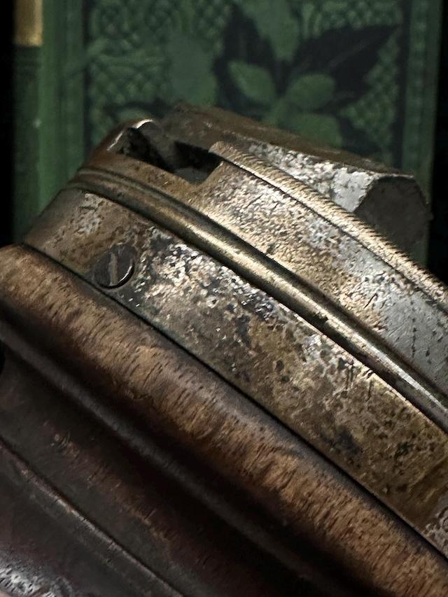 A closer look at the engraved brass components of the Antique Wooden Rotating Workbench, showcasing the tool's historical significance and the fine craftsmanship of the era.