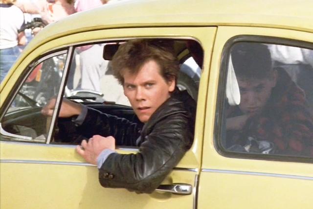 A memorable moment from the 1984 classic "Footloose," where Kevin Bacon plays Ren McCormack, a teenager challenging a small town’s ban on dancing