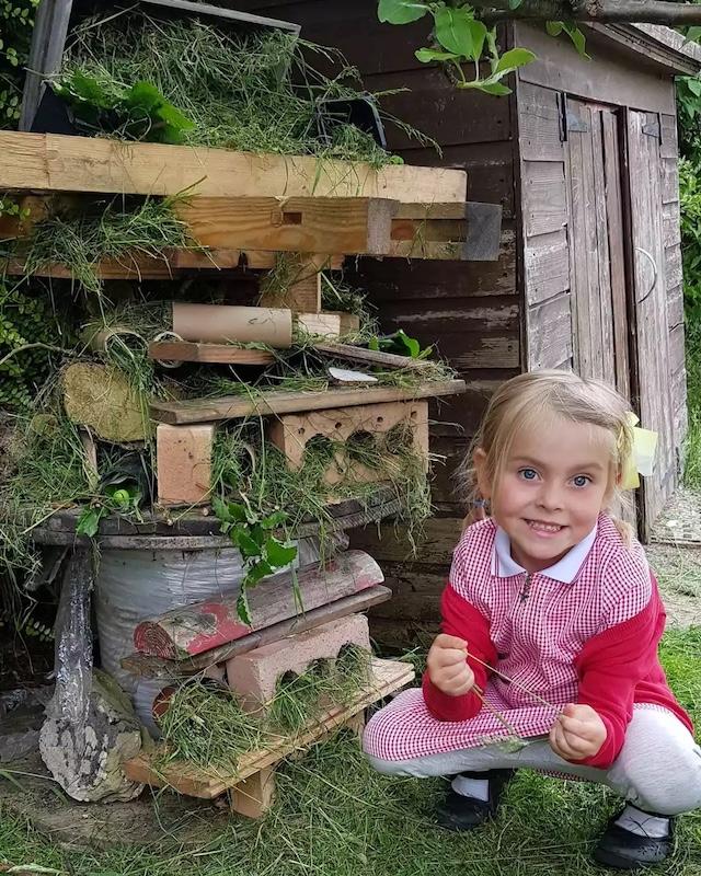Matilda's dedication to nature and the environment was evident even at a young age, seen here with her handmade bug hotel made to foster wildlife in her garden