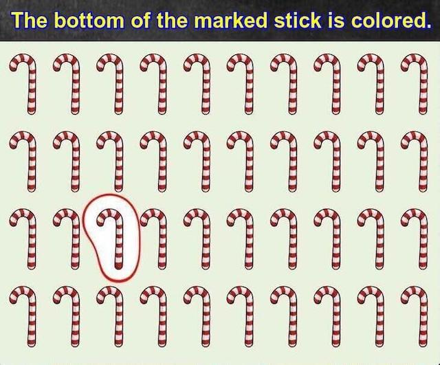 Solution revealed: The marked candy cane has a colored bottom, making it the odd one out