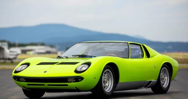 The stunning Lamborghini Miura P400 in its striking lime green color stands as an icon of mid-engine supercar design, revolutionizing the world of performance cars when it was first unveiled in 1966.