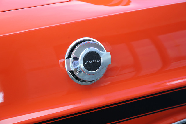 The fuel cap on the 1970 Dodge Challenger R/T, embossed with "FUEL," showcasing the attention to detail and classic design that makes this muscle car iconic.