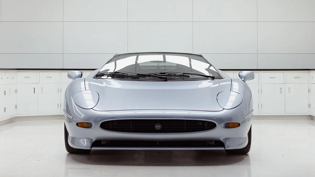 The striking front profile of the Jaguar XJ220, with its sleek design and distinctive styling that made it one of the most ambitious supercars of the early 90s.