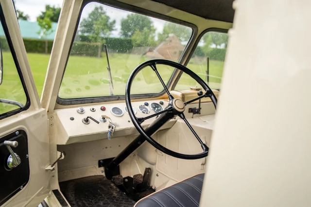 This image showcases the well-preserved dashboard and vintage controls, capturing the rugged charm and functional simplicity of the vehicle's early design.