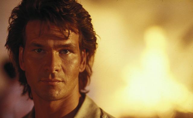 Patrick Swayze as Dalton in Road House (1989)—the legendary bouncer whose martial arts mastery and intense fight scenes remain unforgettable.