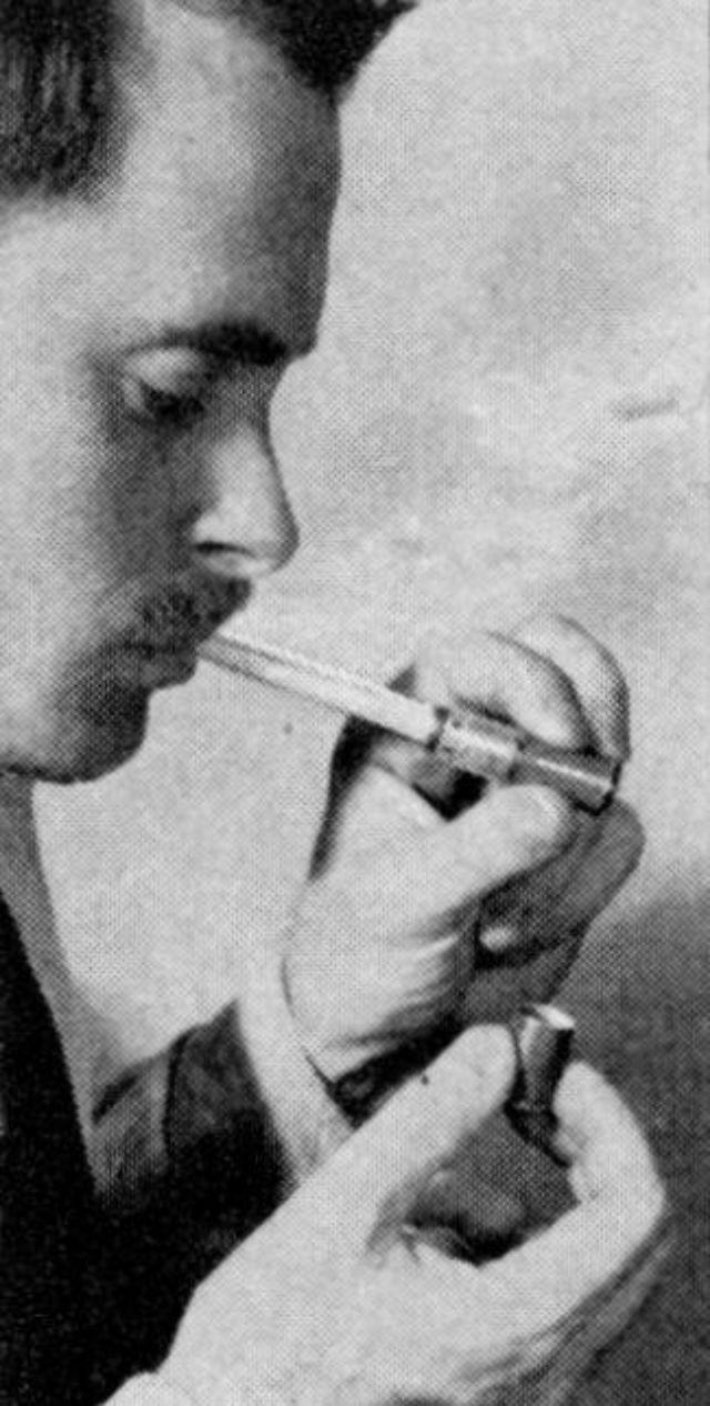 A cigarette lit by the glow of a special lighter – eliminating the need for flame altogether.