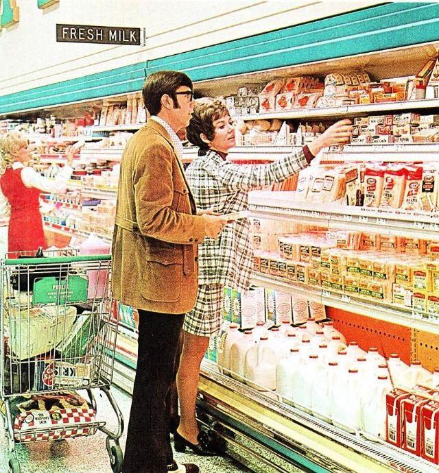 A couple browsing the dairy section, 1969