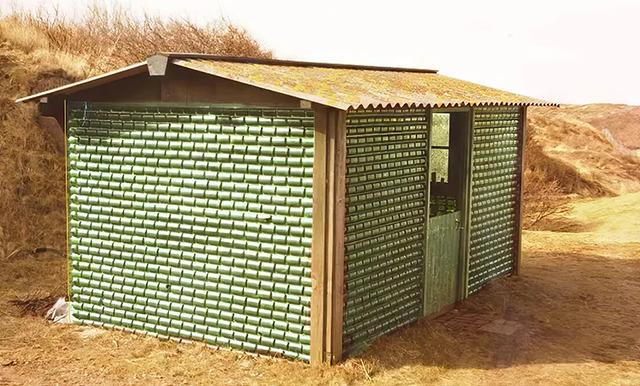 A shed constructed using Heineken's innovative bottle bricks as part of the company's 1964 effort to reduce waste and build sustainable structures.