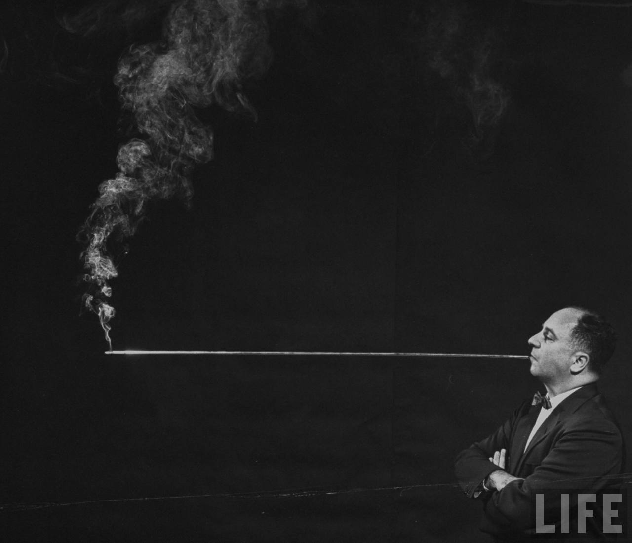 A telescoping holder that extends up to 4 feet – because why not enjoy your cigarette from a distance? (Photo by Joel Yale/LIFE magazine).