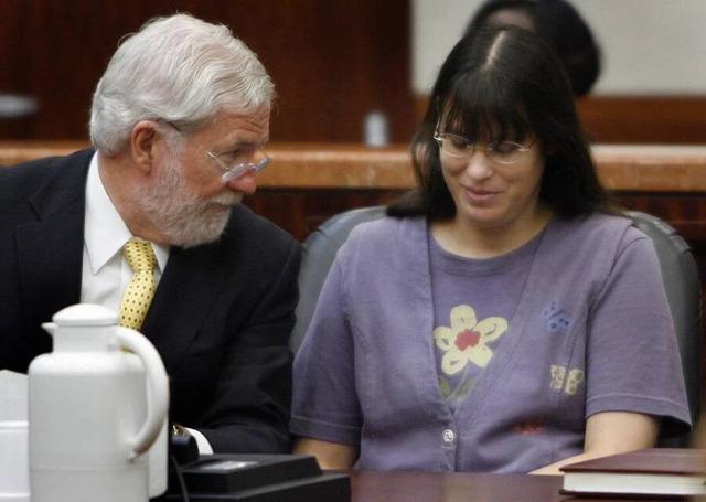 Andrea Yates, alongside her attorney George Parnham, during her intense retrial in July 2006.