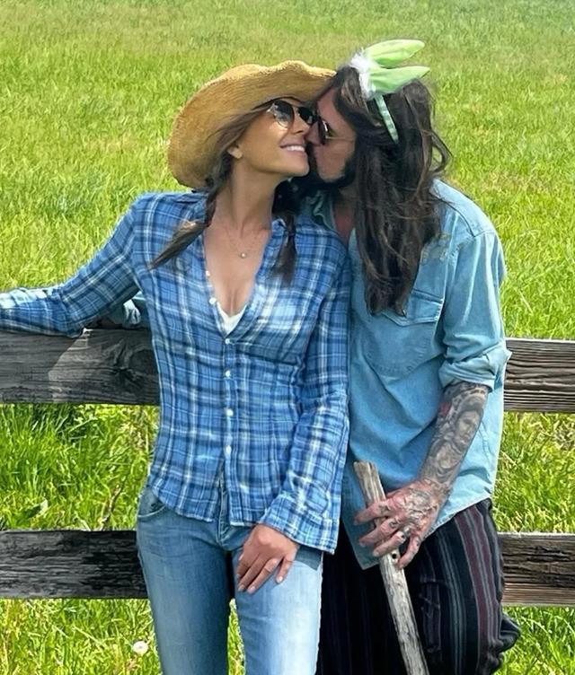 Elizabeth Hurley and Billy Ray Cyrus posted a cozy photo on Instagram, embracing in the serene countryside with the caption “Happy Easter,” 