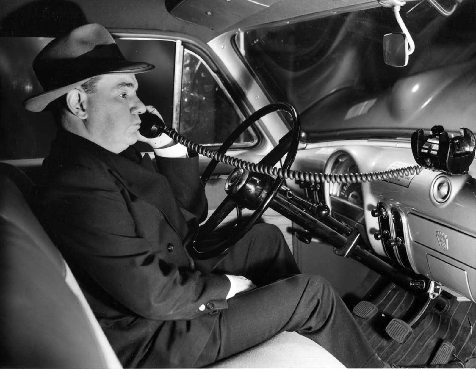 In 1954, a man was seen using one of the earliest mobile telephones while cruising through the streets in his automobile.