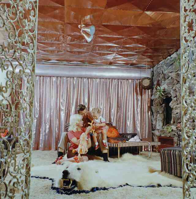 Jayne Mansfield, Mickey Hargitay, and Miklós Hargitay Jr. inside their iconic "Pink Palace," a home filled with Hollywood glamour. ALLAN GRANT/THE LIFE PICTURE COLLECTION/SHUTTERSTOCK