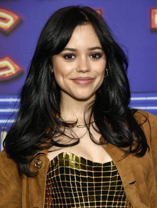 Jenna Ortega looks effortlessly chic with her signature dark locks and radiant smile at a recent event
