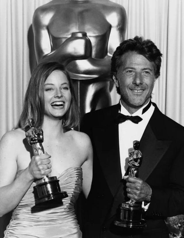 Jodie Foster and Dustin Hoffman Holding Oscars – A historic Oscar moment, with both stars posing proudly with their awards.