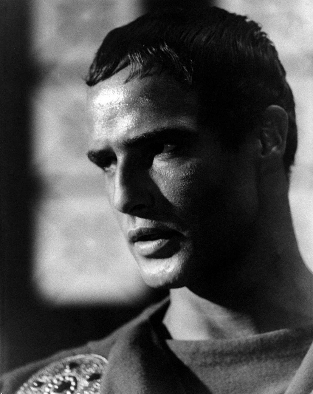 Marlon Brando delivering an iconic speech in Julius Caesar, commanding the crowd.