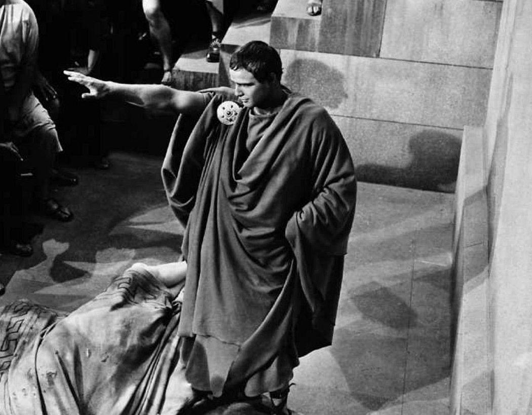 Marlon Brando in a heated moment from Julius Caesar, with intense focus and powerful presence.