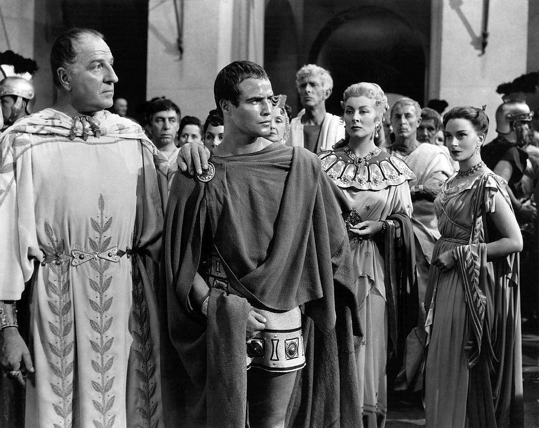 Marlon Brando striking a dramatic pose, showing off his chiseled figure as Mark Antony.