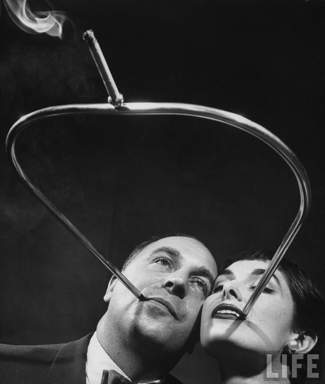 The Lovers’ Cigarette Holder – a romantic design for couples who enjoy their cigarettes together. (Photo by Joel Yale/LIFE magazine).