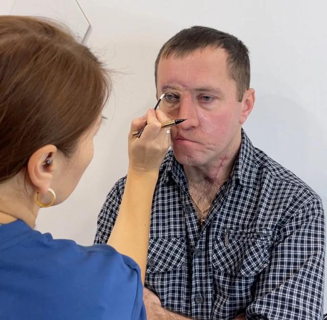 The artist carefully mapped out the perfect placement, ensuring the tattooed eye would seamlessly blend with the unique features of Pavel’s face.