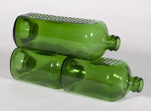 The neck of the bottle fit perfectly into a recess at the base, ensuring stability and ease of construction