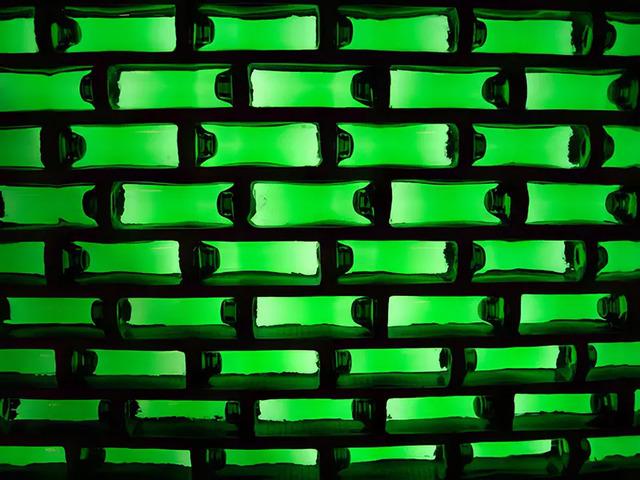 When laid horizontally, the bottles would create walls that could form the foundation of a building. A 10 ft by 10 ft shack would require about 1,000 WOBOs.