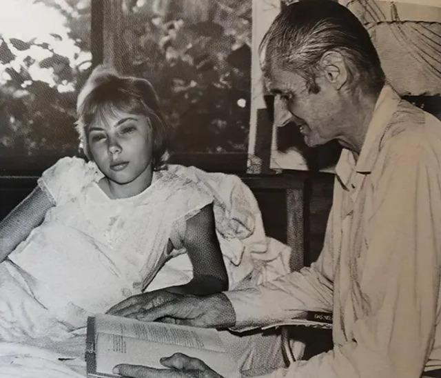 After miraculously surviving the crash and enduring 11 days alone in the Amazon, Juliane rests in a Peruvian hospital, comforted by her father’s presence. (Photo credit: Juliane Koepcke).