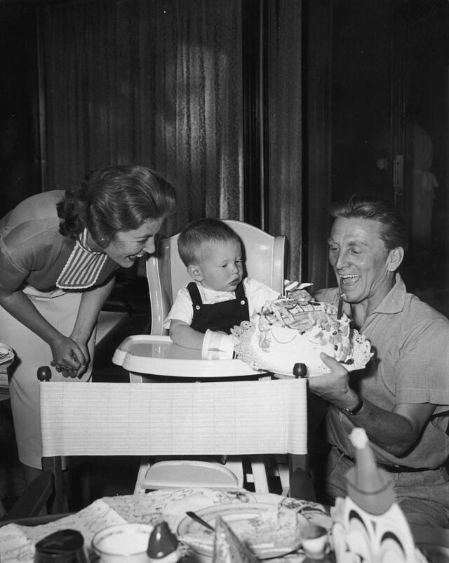 Kirk Douglas and his second wife Anne celebrating their son Peter's first birthday in 1956.