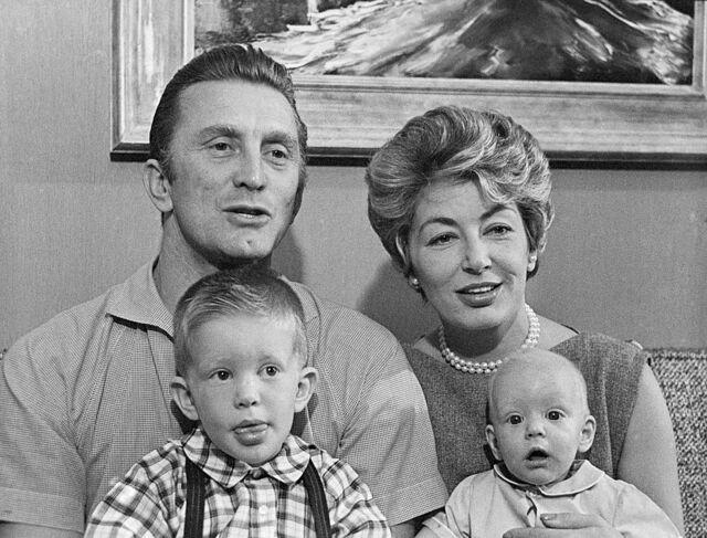 Kirk Douglas with his wife Anne, and sons Peter (left) and Eric (right), in 1958—an unforgettable family portrait.