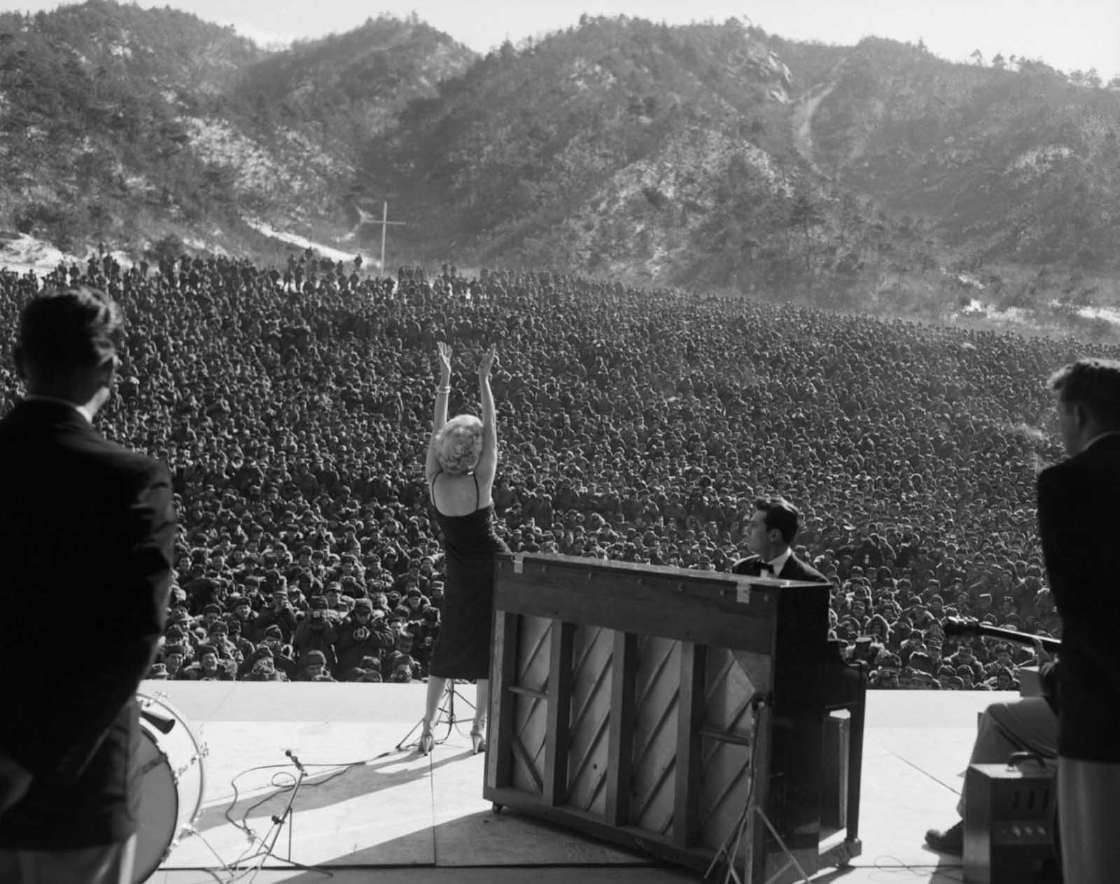 Marilyn Monroe gracing the stage before an audience of thousands in Korea, 1954.