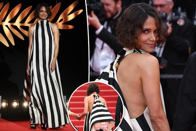 She chose a modest black-and-white striped Jacquemus gown that met the new rules while keeping her signature elegance.