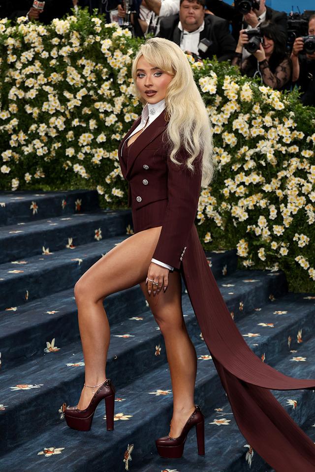 She showed up in a tailored burgundy blazer, complete with shiny buttons and a white collar. 