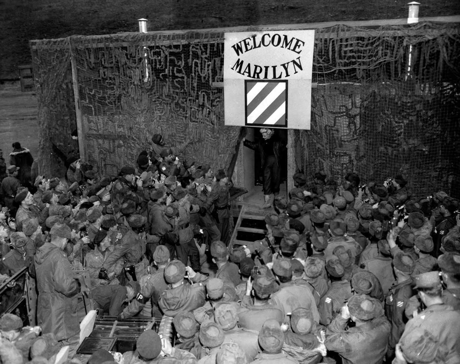 The troops were completely enamored by her, showering her with affection and admiration.