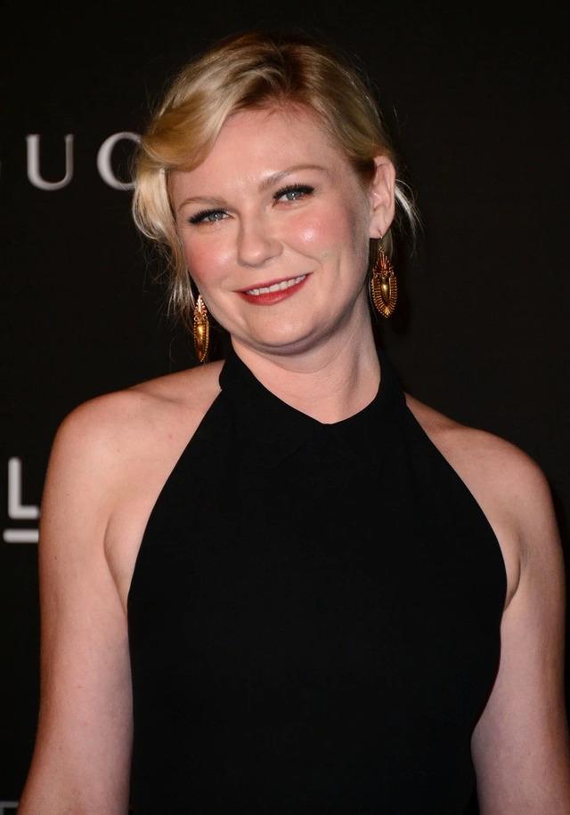 Kirsten Dunst proudly describes her smile as "vintage," embracing her unique features and revealing that she prefers to stand out rather than conform to the cookie-cutter smiles of Hollywood.