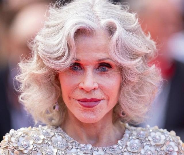 Each step she took showed decades of confidence, her silver hair softly framing her glowing face.