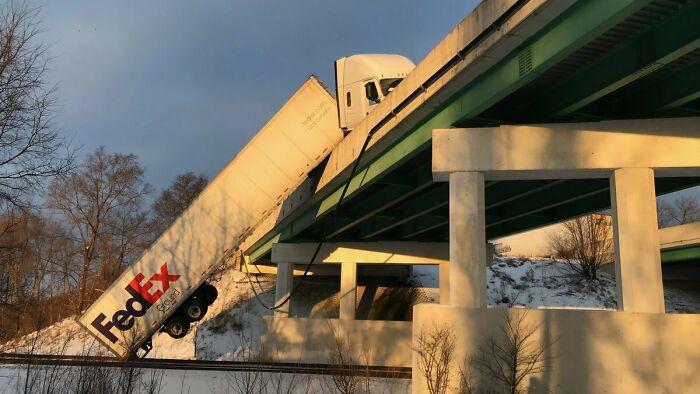FedEx Truck Hung Off Toll Road After Hitting Ice